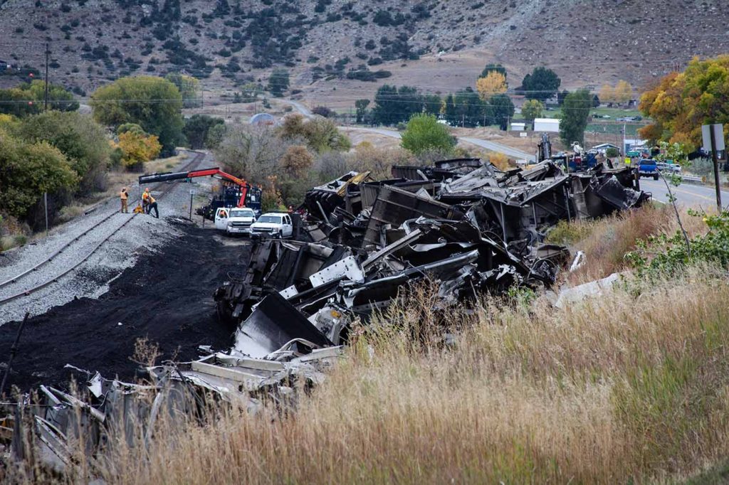 crews removing wrecked train cars